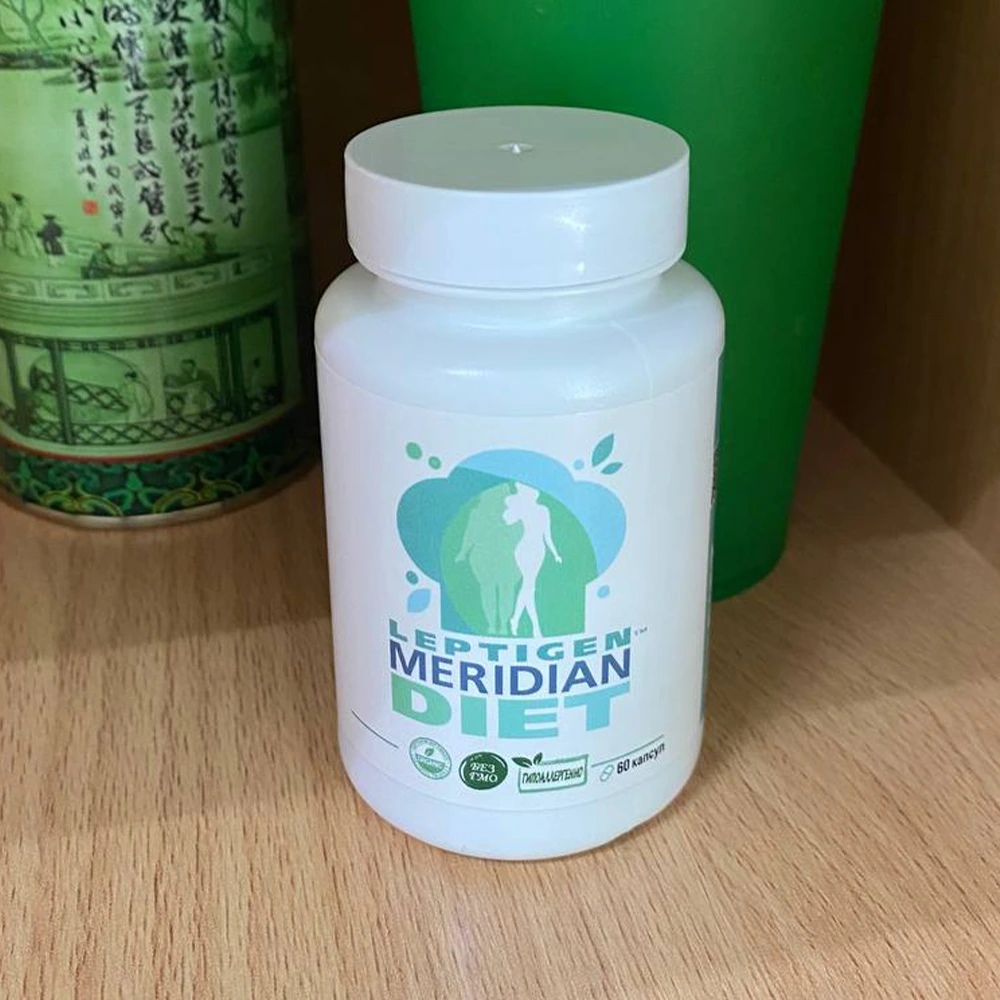 Баночка с капсулами для похужения Leptigen Meridian Diet стоит на столе