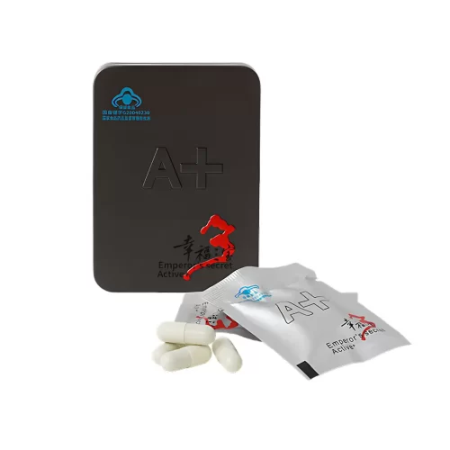 Секрет Императора Актив+ - белые капсулы рядом с пакетиком и черной металлической коробкой