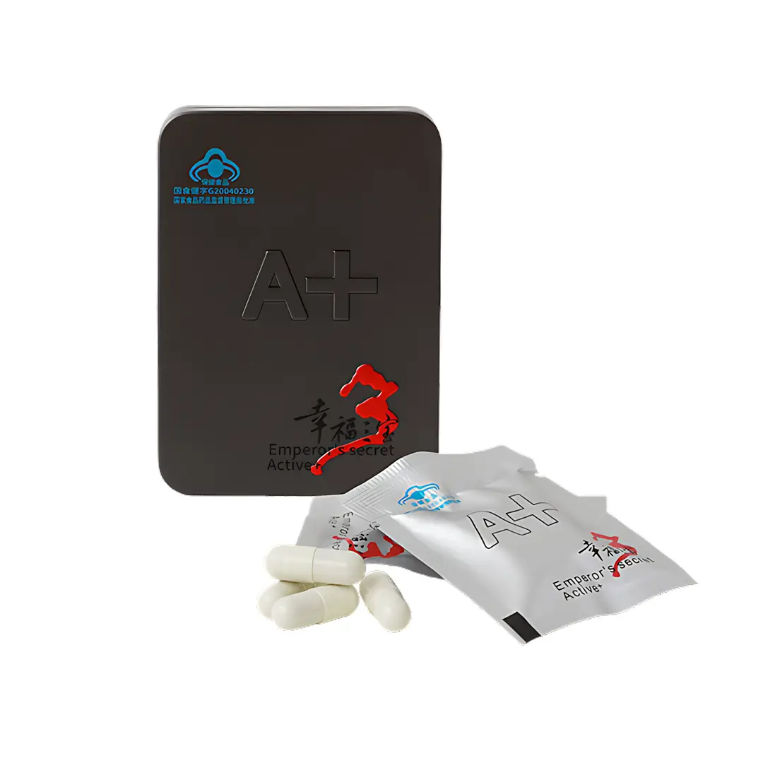 Секрет Императора Актив+ - белые капсулы рядом с пакетиком и черной металлической коробкой
