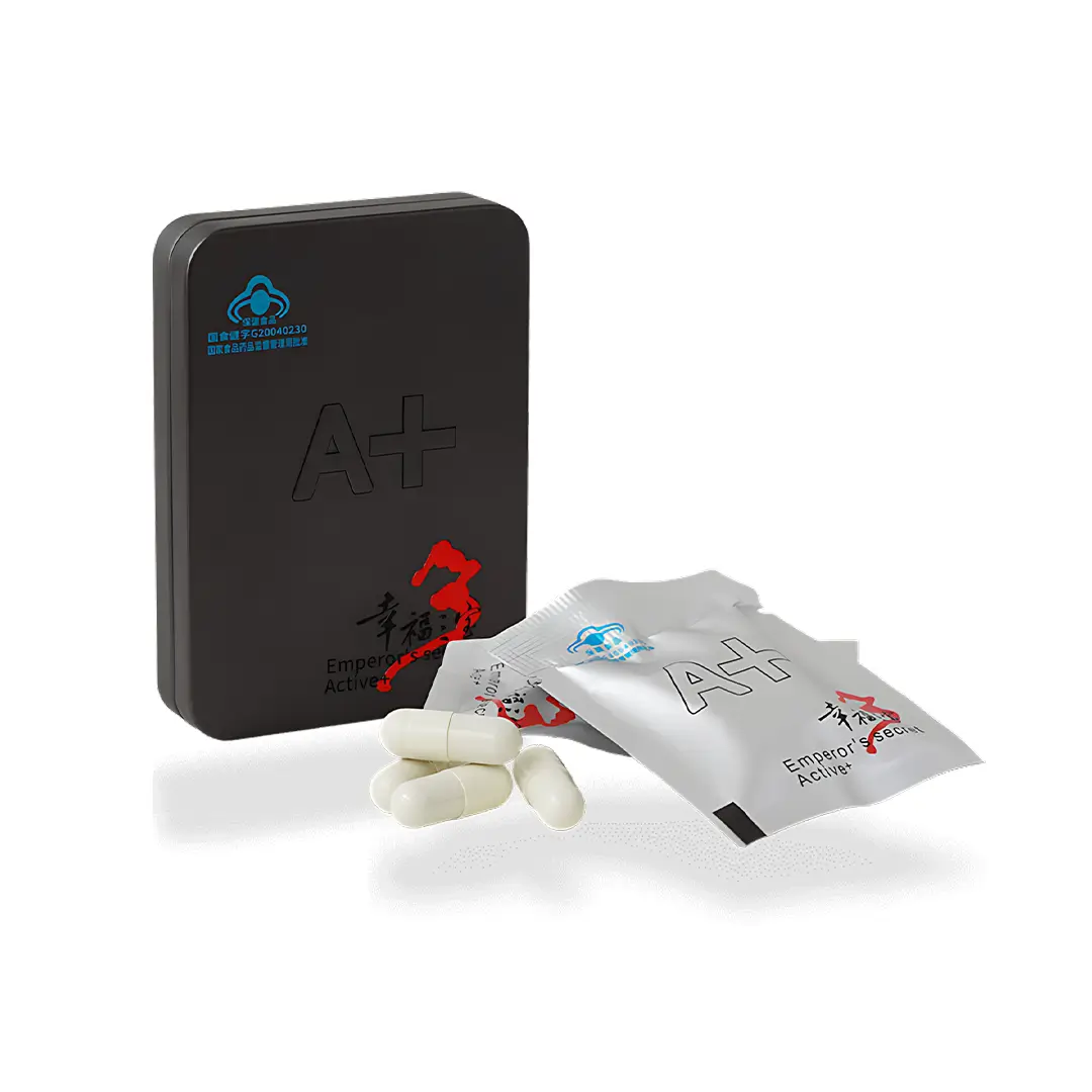 Секрет Императора Актив+ - белые капсулы рядом с пакетиком и черной металлической коробкой